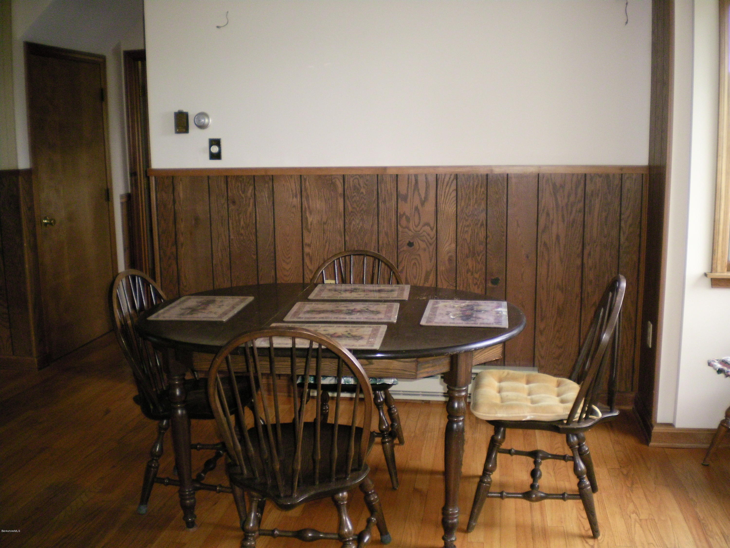 7 Pierce Road Peru, MA 01235 - Photo 16 of 29 a view of a table and chairs in wooden floor
