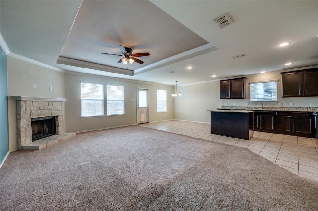 1420 Rivers Creek Lane Little Elm, TX 75068 - Photo 2 of 25 a view of an empty room with a fireplace and a window