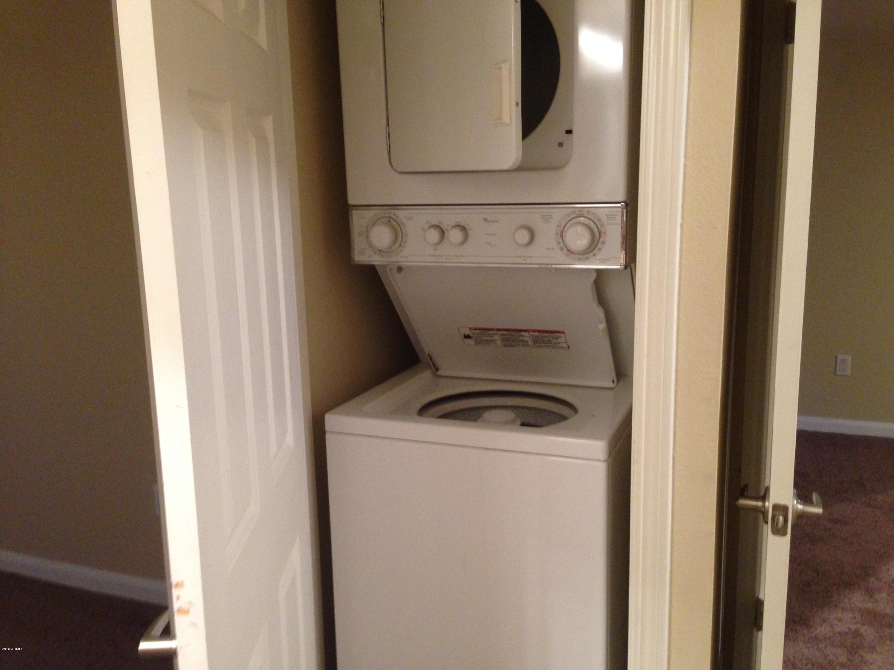 8256 East Arabian Trail, Unit 132 Scottsdale, AZ 85258 - Photo 15 of 19 a utility room with dryer and washer