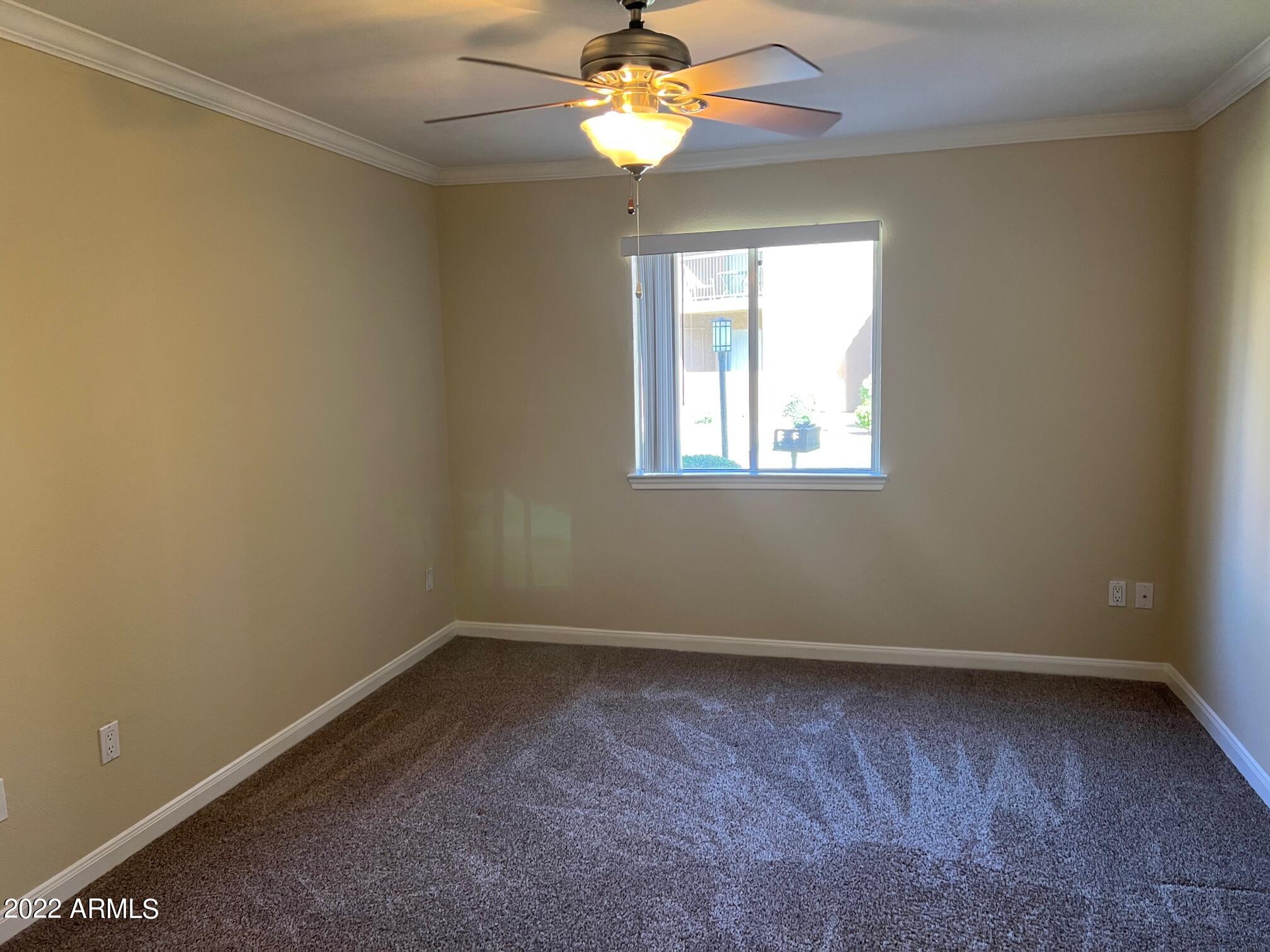 8256 East Arabian Trail, Unit 132 Scottsdale, AZ 85258 - Photo 10 of 19 an empty room with a window