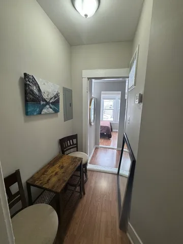 a room with furniture and a mirror