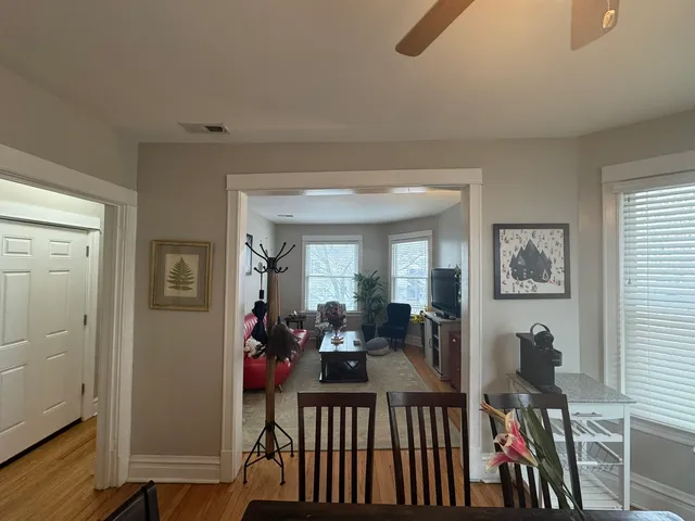 a view of a living room and dining room