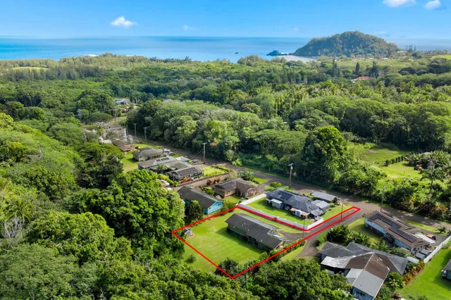 an aerial view of a house with pool outdoor seating
