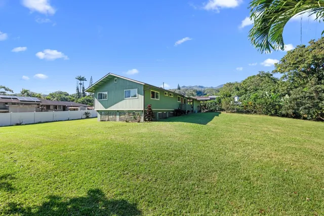 a swimming pool is sitting in the middle of a green field