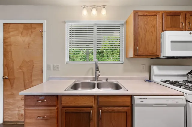 a kitchen with a sink and cabinets