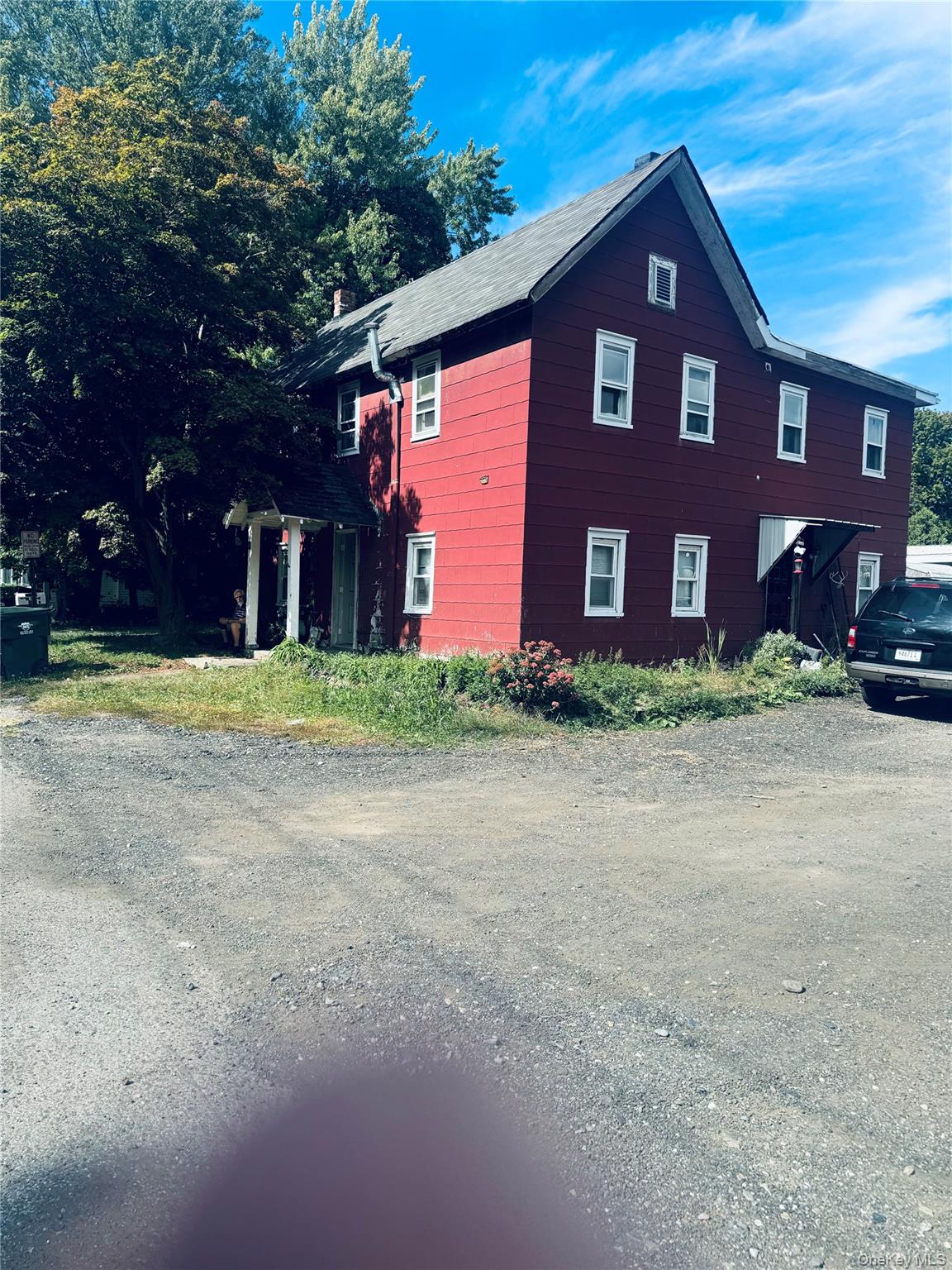 68 Waterstone Road, Unit 2 Greenwood Lake, NY 10925 - Photo 1 of 1 a front view of a house with a yard