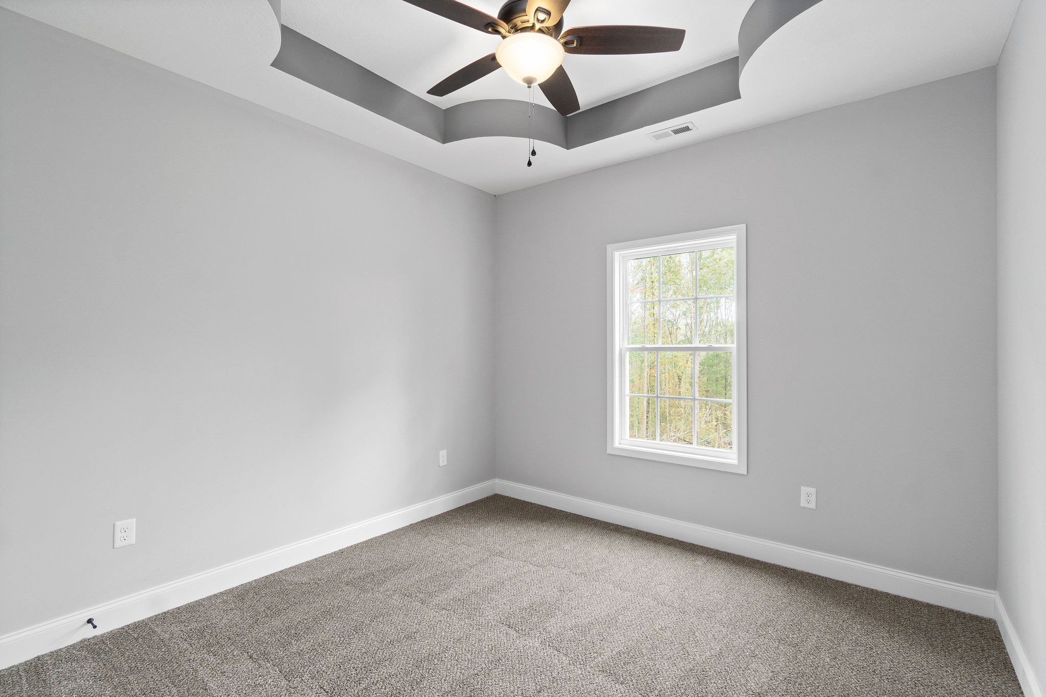 2770 Russell Road Palmyra, TN 37142 - Photo 22 of 32 an empty room with a window and a fan