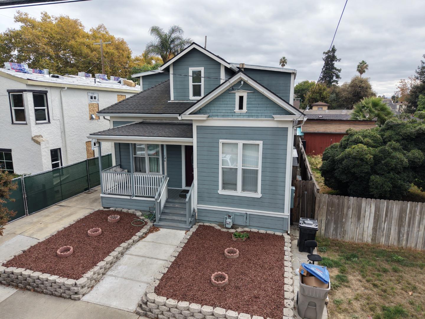 22 South 10th Street San Jose, CA 95112 - Photo 2 of 25 a front view of a house with a yard
