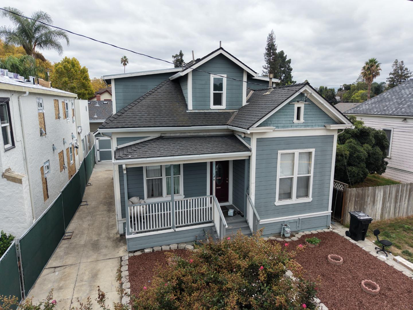 22 South 10th Street San Jose, CA 95112 - Photo 3 of 25 a house with trees in the background