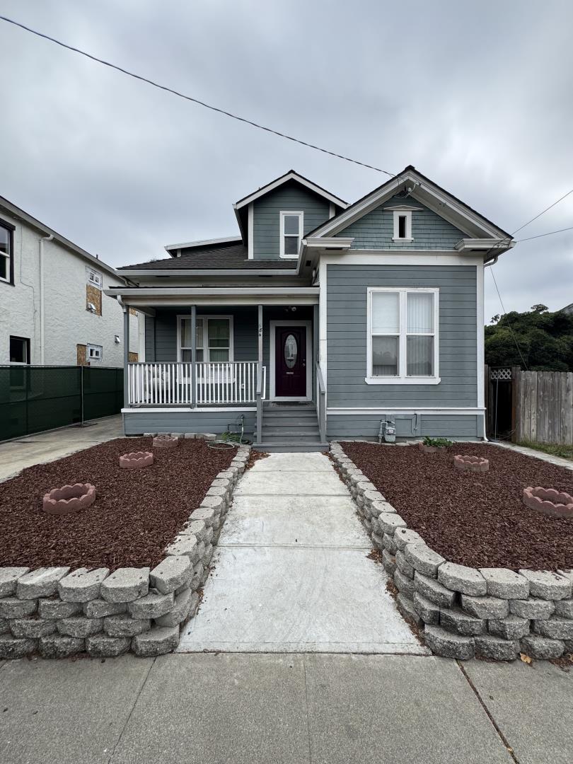 22 South 10th Street San Jose, CA 95112 - Photo 4 of 25 a front view of a house with a yard