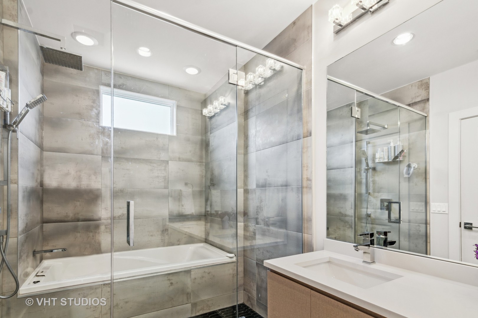 1209 East 46th Street, Unit 4E Chicago, IL 60653 - Photo 10 of 15 a bathroom with a sink and shower