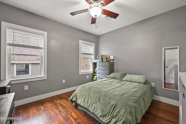 a bed room with a bed and television