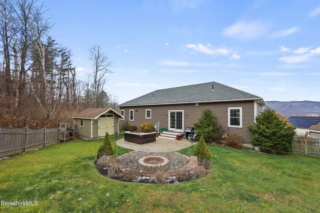a view of backyard with green space