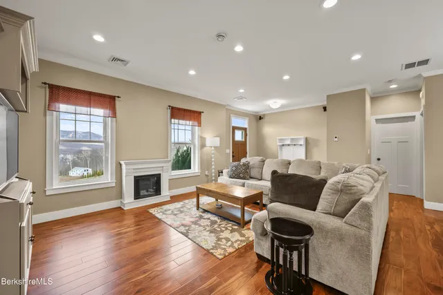 a living room with furniture or fireplace and a wooden floor