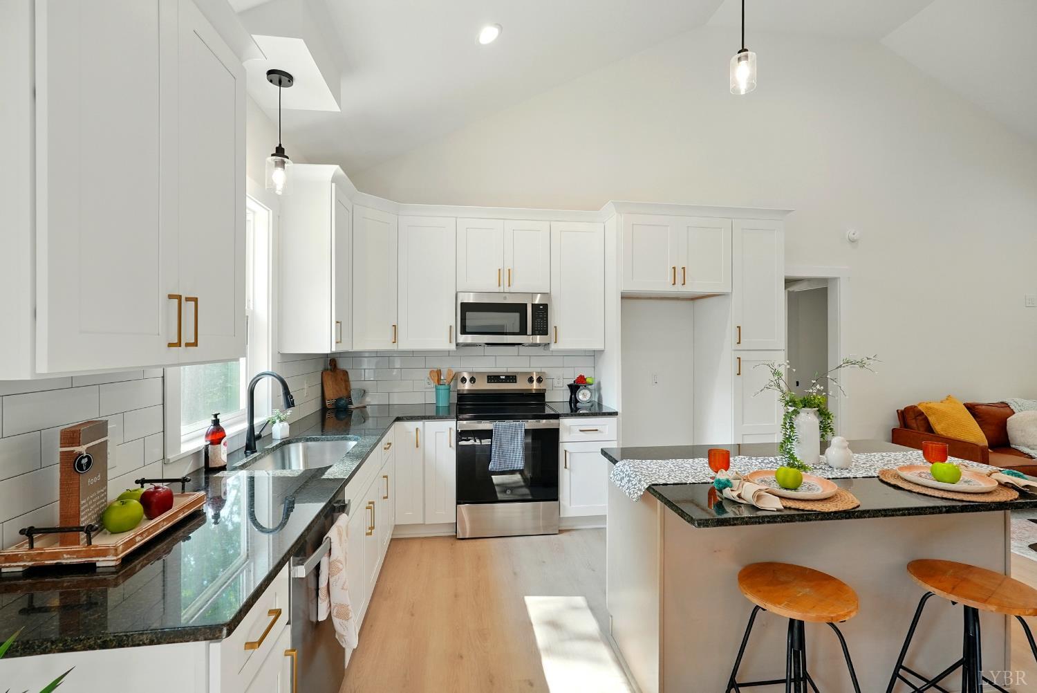 8 Fescue Circle Huddleston, VA 24104 - Photo 10 of 31 a kitchen with granite countertop a stove a sink and a refrigerator