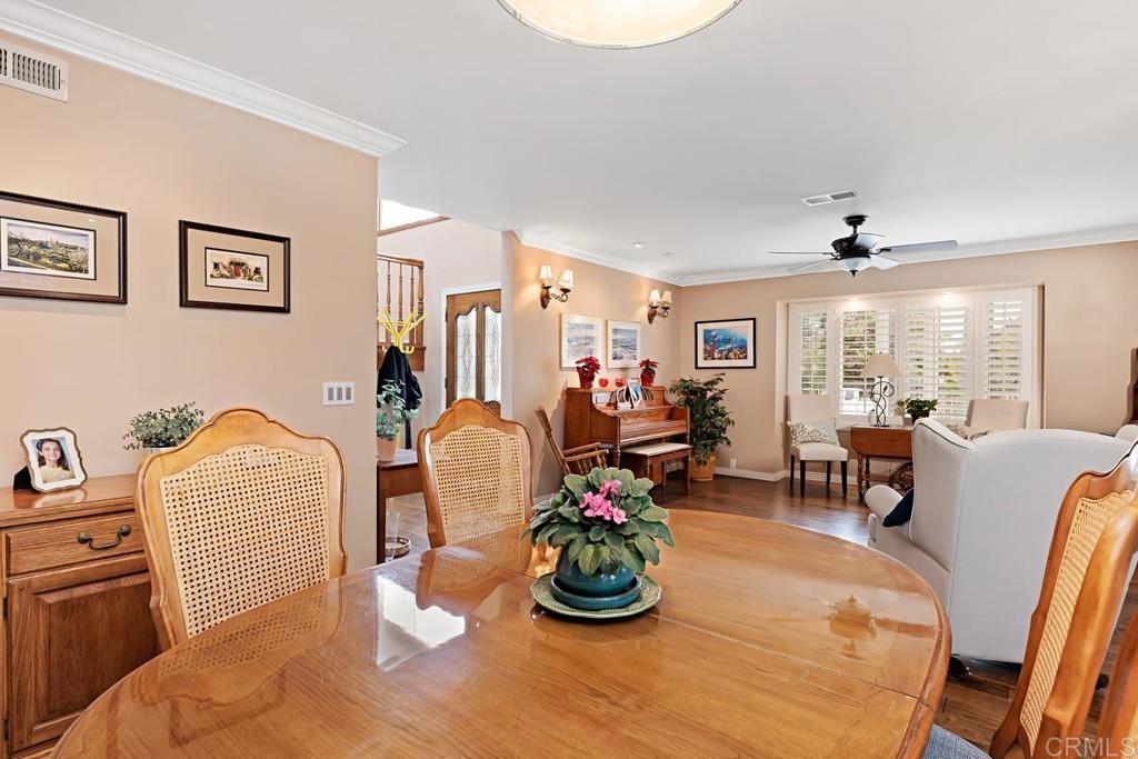 1369 Cherrytree Court Encinitas, CA 92024 - Photo 16 of 41 a living room with furniture a window and gym equipment