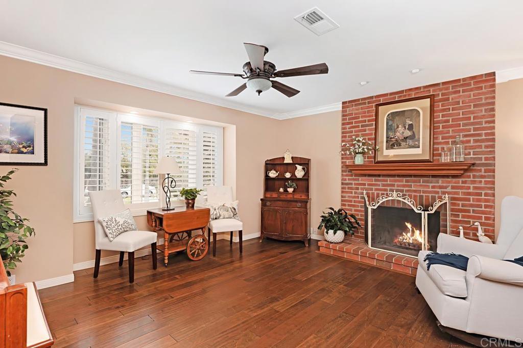 1369 Cherrytree Court Encinitas, CA 92024 - Photo 17 of 41 a living room with furniture and a fireplace
