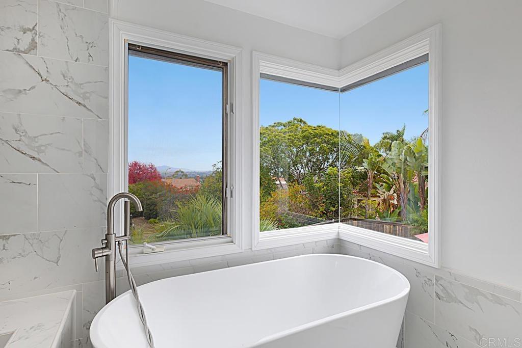 1369 Cherrytree Court Encinitas, CA 92024 - Photo 23 of 41 a white bath tub sitting next to a window