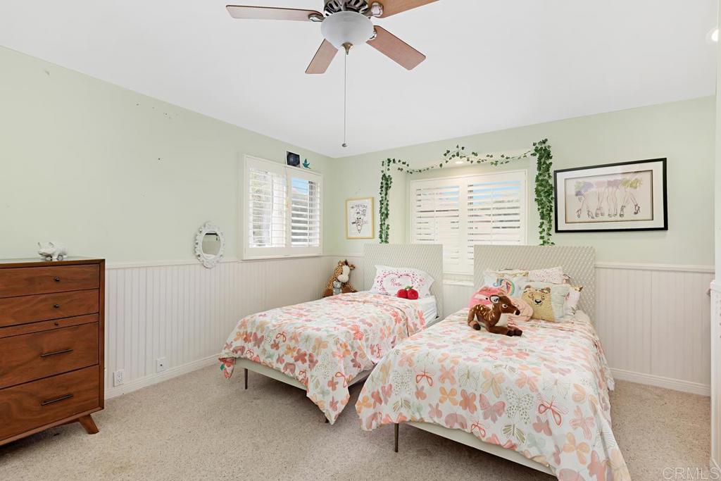1369 Cherrytree Court Encinitas, CA 92024 - Photo 25 of 41 a bedroom with two beds and painting on the wall