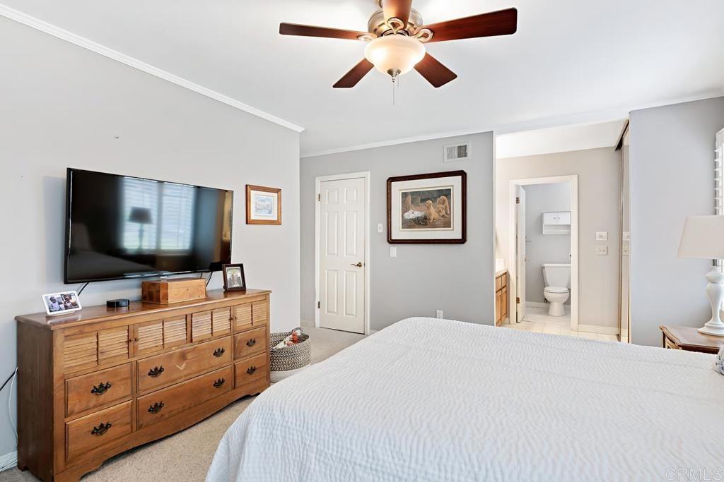 1369 Cherrytree Court Encinitas, CA 92024 - Photo 30 of 41 a bedroom with a bed and a flat screen tv