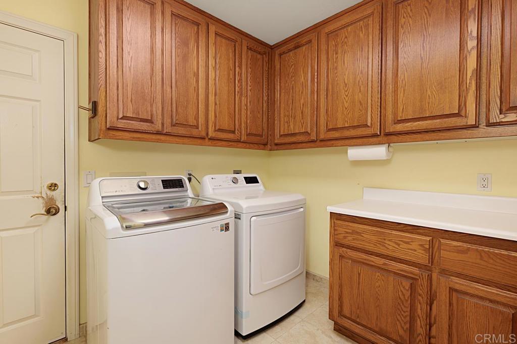 1369 Cherrytree Court Encinitas, CA 92024 - Photo 33 of 41 a utility room with dryer and washer