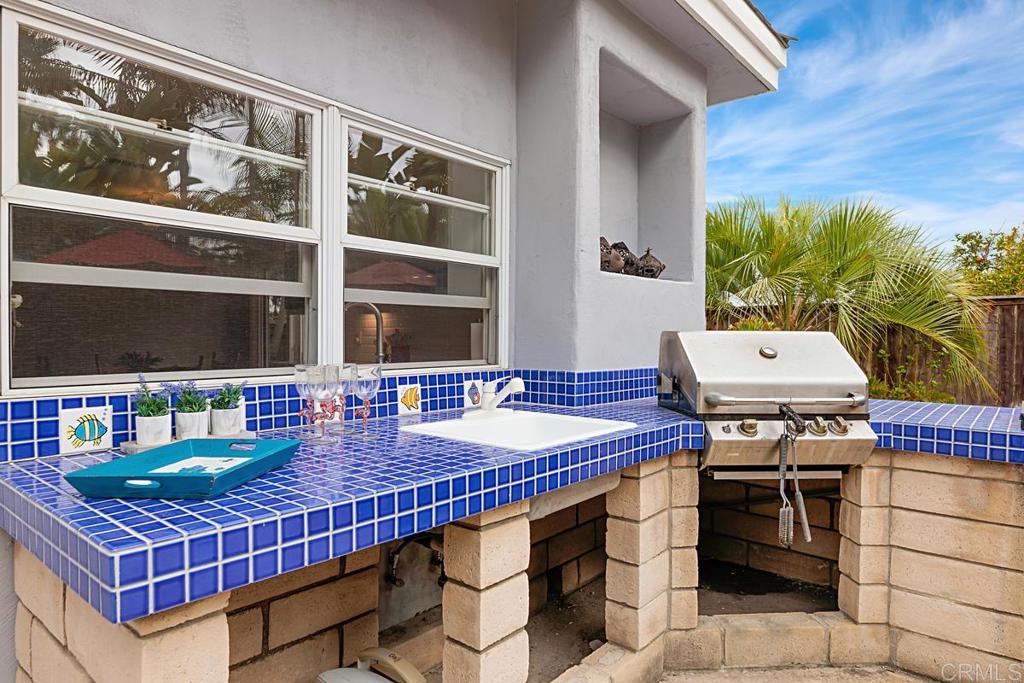 1369 Cherrytree Court Encinitas, CA 92024 - Photo 36 of 41 a balcony with chairs and table