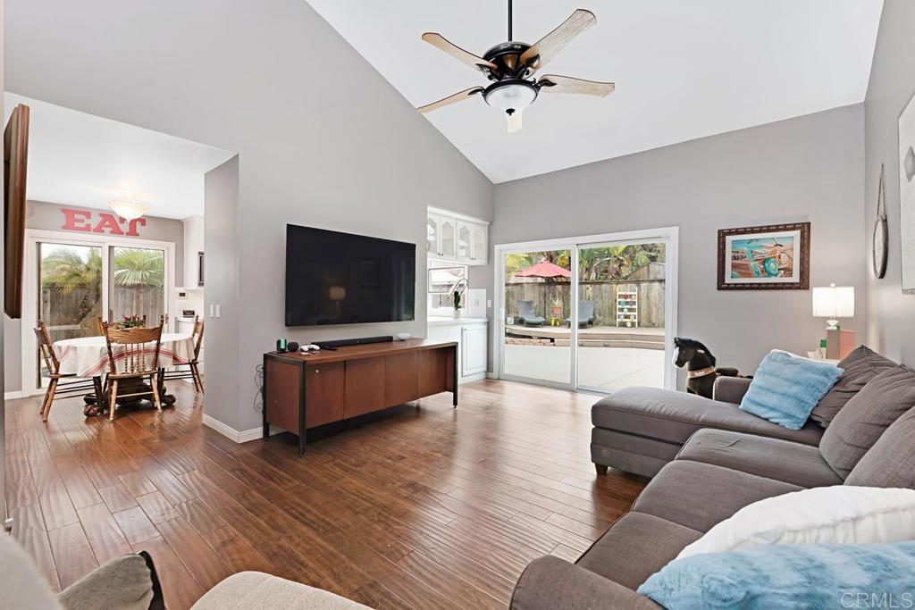 1369 Cherrytree Court Encinitas, CA 92024 - Photo 7 of 41 a living room with furniture and a flat screen tv