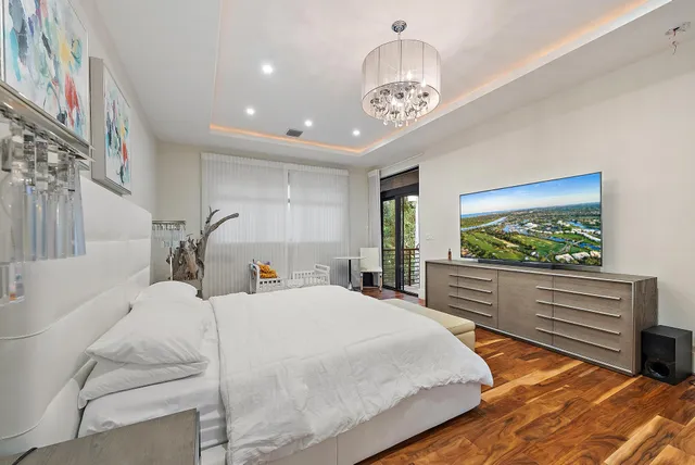 a bathroom with a granite countertop sink mirror and shower