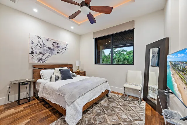 a bathroom with a sink toilet double vanity and shower