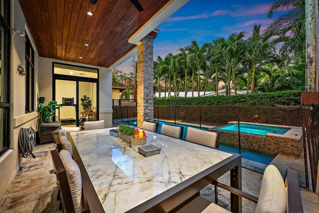 a view of an outdoor dining space with furniture