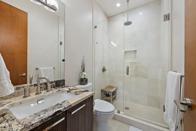 a bedroom with furniture and a rug