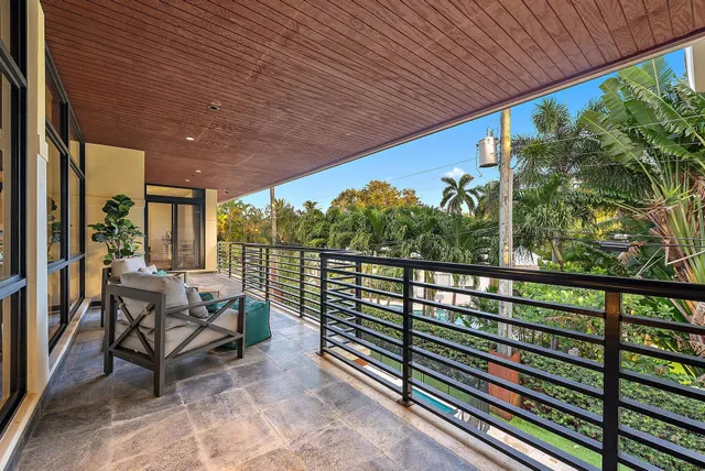 a swimming pool with outdoor seating and yard