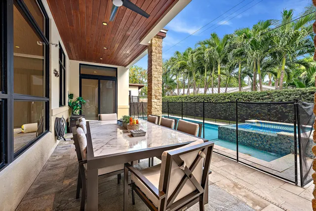 a view of an outdoor sitting area with furniture