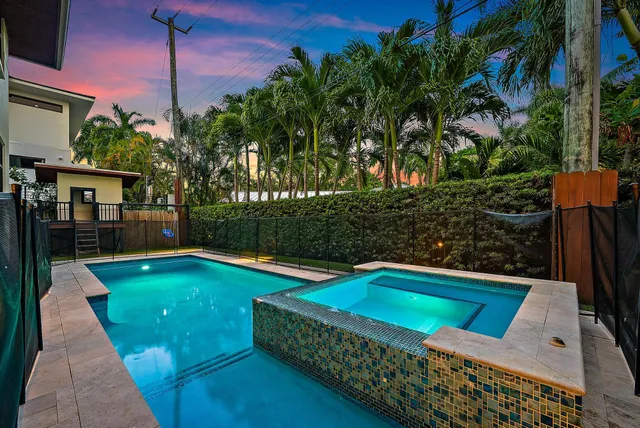 a view of a patio with a table and chairs