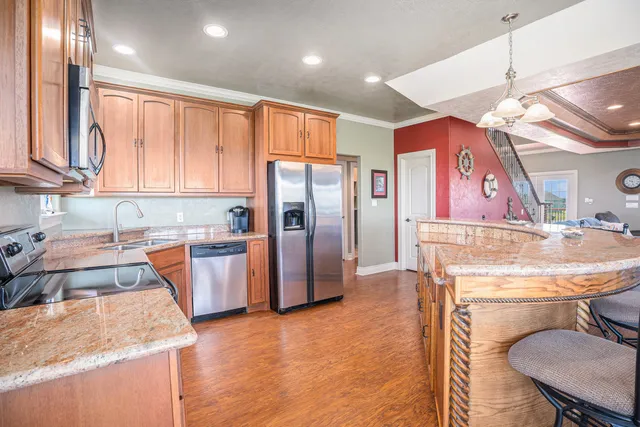 a bedroom with a bed and a chandelier