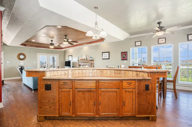 a bedroom with a bed and large window
