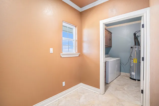 a bedroom with a bed and a flat tv screen on dresser
