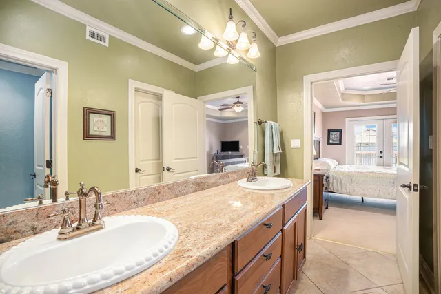 a bathroom with a toilet sink and shower