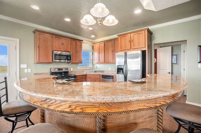 a bedroom with a bed and a flat tv screen on dresser