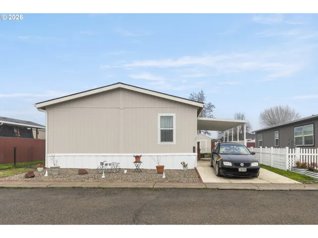 a view of a car parked in front of a house