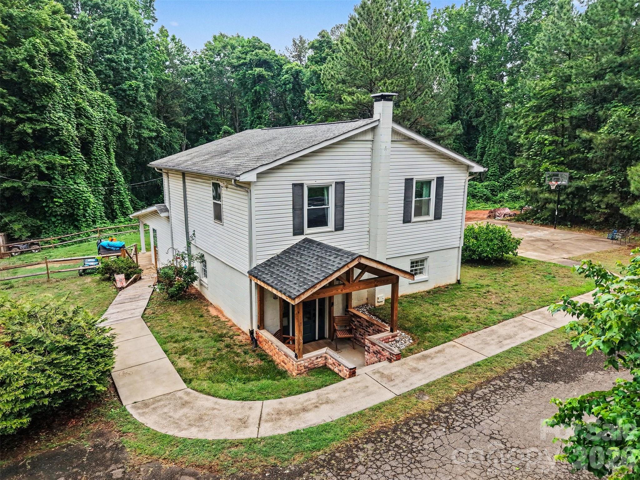 184 Canal Road Belmont, NC 28012 - Photo 3 of 39 a aerial view of a house with a yard patio and fire pit