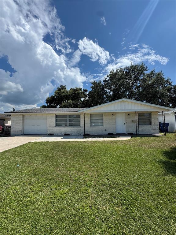 3536 Umber Road Holiday, FL 34691 - Photo 1 of 1 a front view of a house with a yard