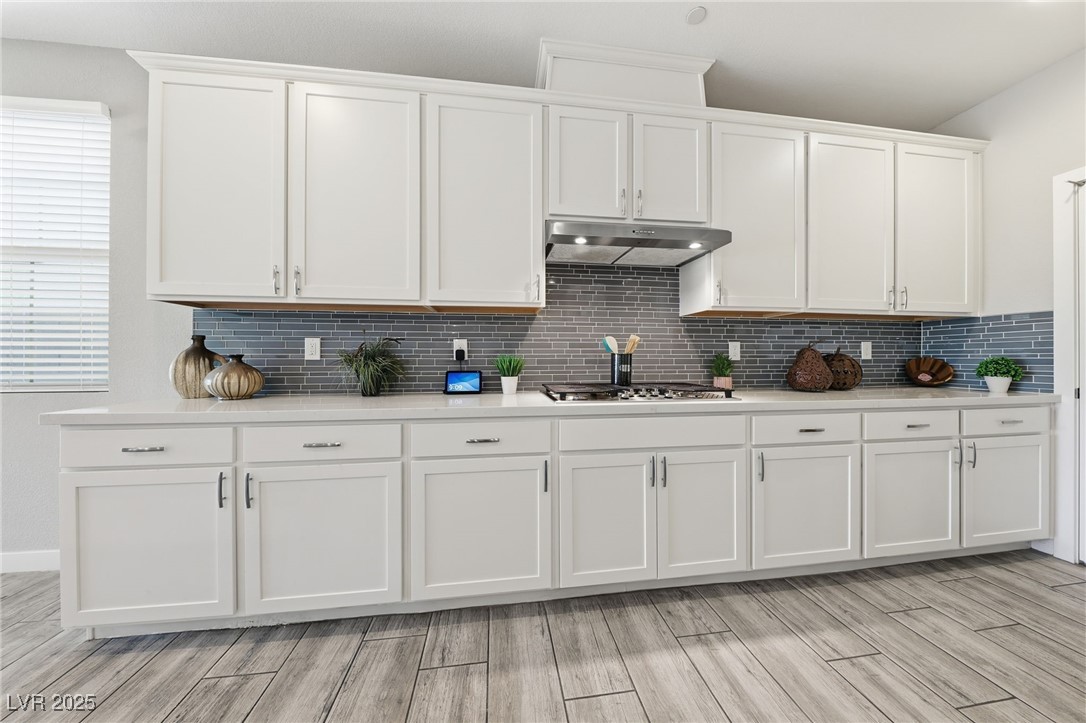 5 Lilla Rosa Street Henderson, NV 89011 - Photo 11 of 25 UGRADED CABINETS WITH TILE BACKSPLASH