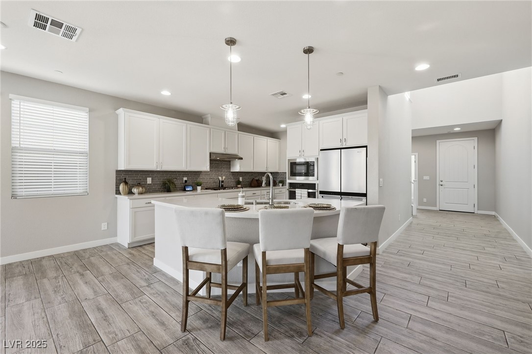 5 Lilla Rosa Street Henderson, NV 89011 - Photo 9 of 25 KITCHEN BREAKFAST BAR