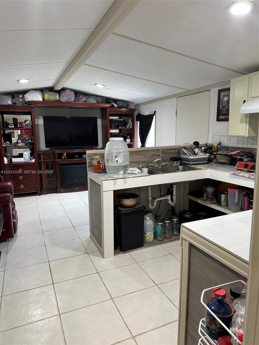 625 North Quebrada Street Clewiston, FL 33440 - Photo 6 of 26 a kitchen with stainless steel appliances granite countertop a stove a sink and a microwave