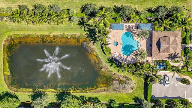 an aerial view of a house with a swimming pool