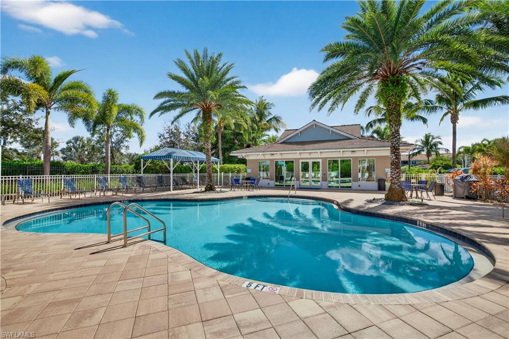 2319 Sawyers Hill Road, Unit 705 Naples, FL 34102 - Photo 29 of 29 Community pool with a patio area and grilling area