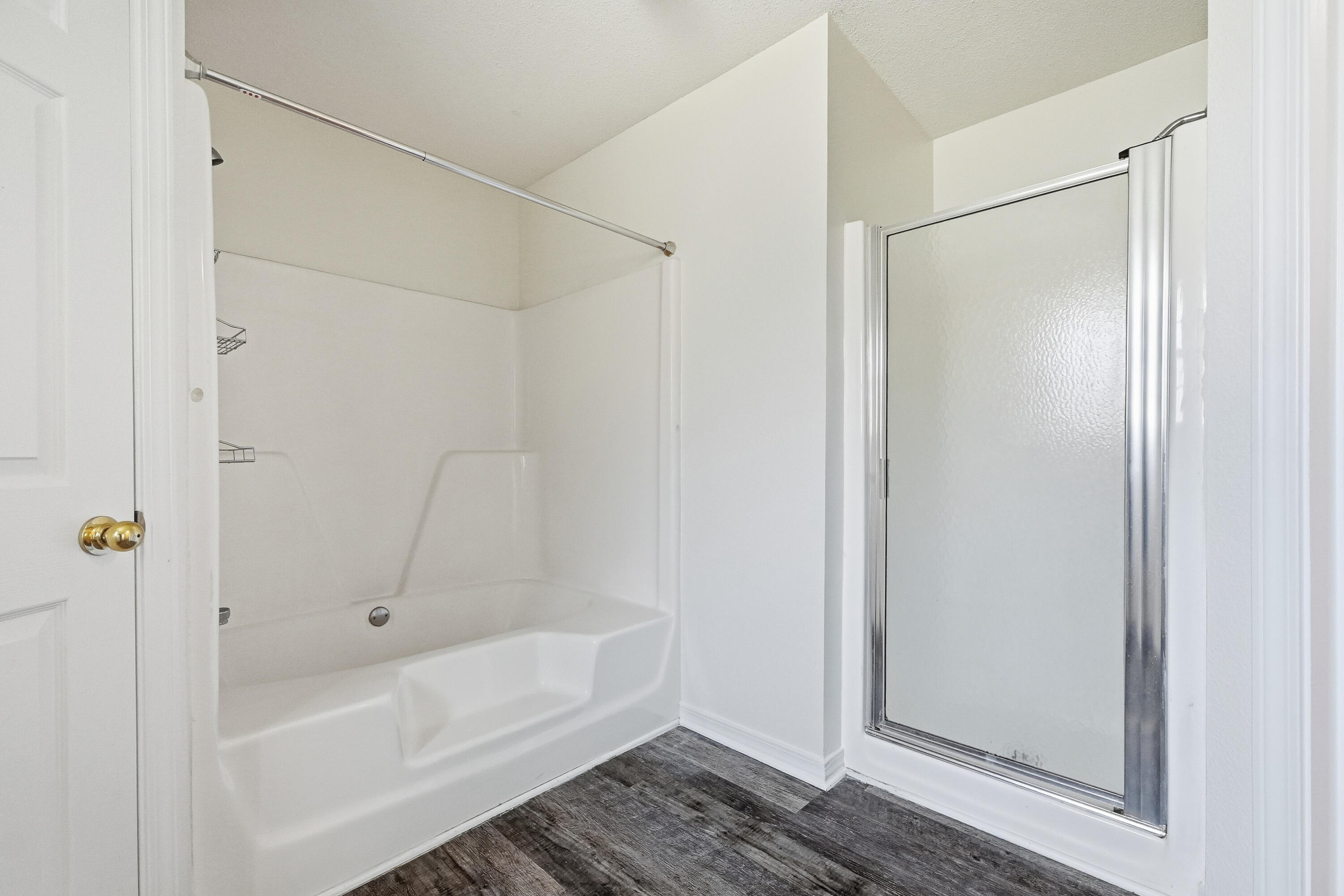 4087 Audiss Road Milton, FL 32583 - Photo 26 of 34 a bathroom with a bathtub and a shower