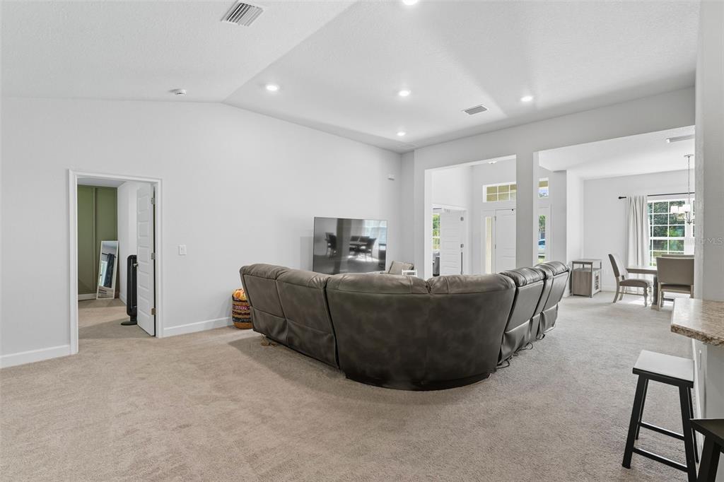 463 Trafalgar Lane Spring Hill, FL 34606 - Photo 11 of 36 a living room with furniture and a dining table