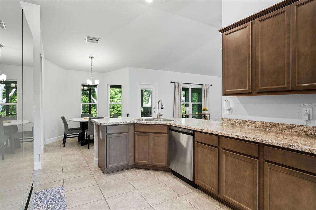 463 Trafalgar Lane Spring Hill, FL 34606 - Photo 14 of 36 a kitchen with a sink and cabinets